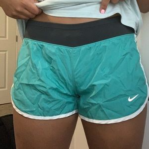 Nike turquoise athletic shorts.